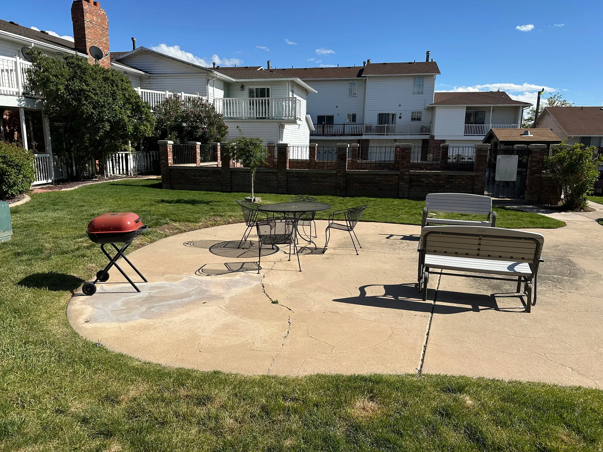 View of property's community featuring a patio area and a balcony