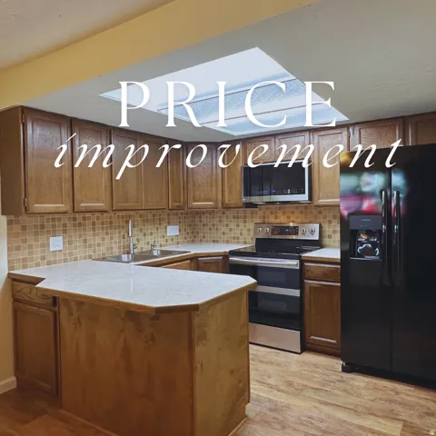 Kitchen featuring wood-finish cabinetry, light-toned countertops, and a mosaic tile backsplash