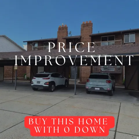 Brick exterior building featuring multiple units, covered parking, and private balconies
