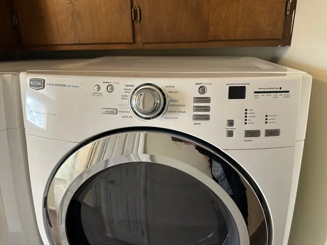 Laundry room with washer / clothes dryer and cabinet space
