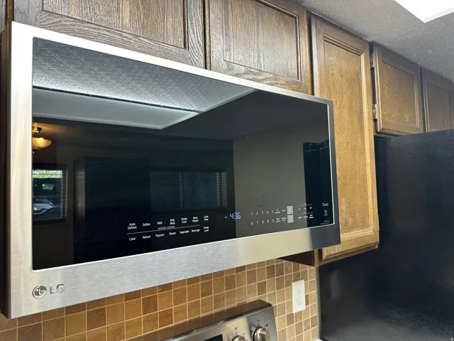Kitchen view of stainless steel microwave