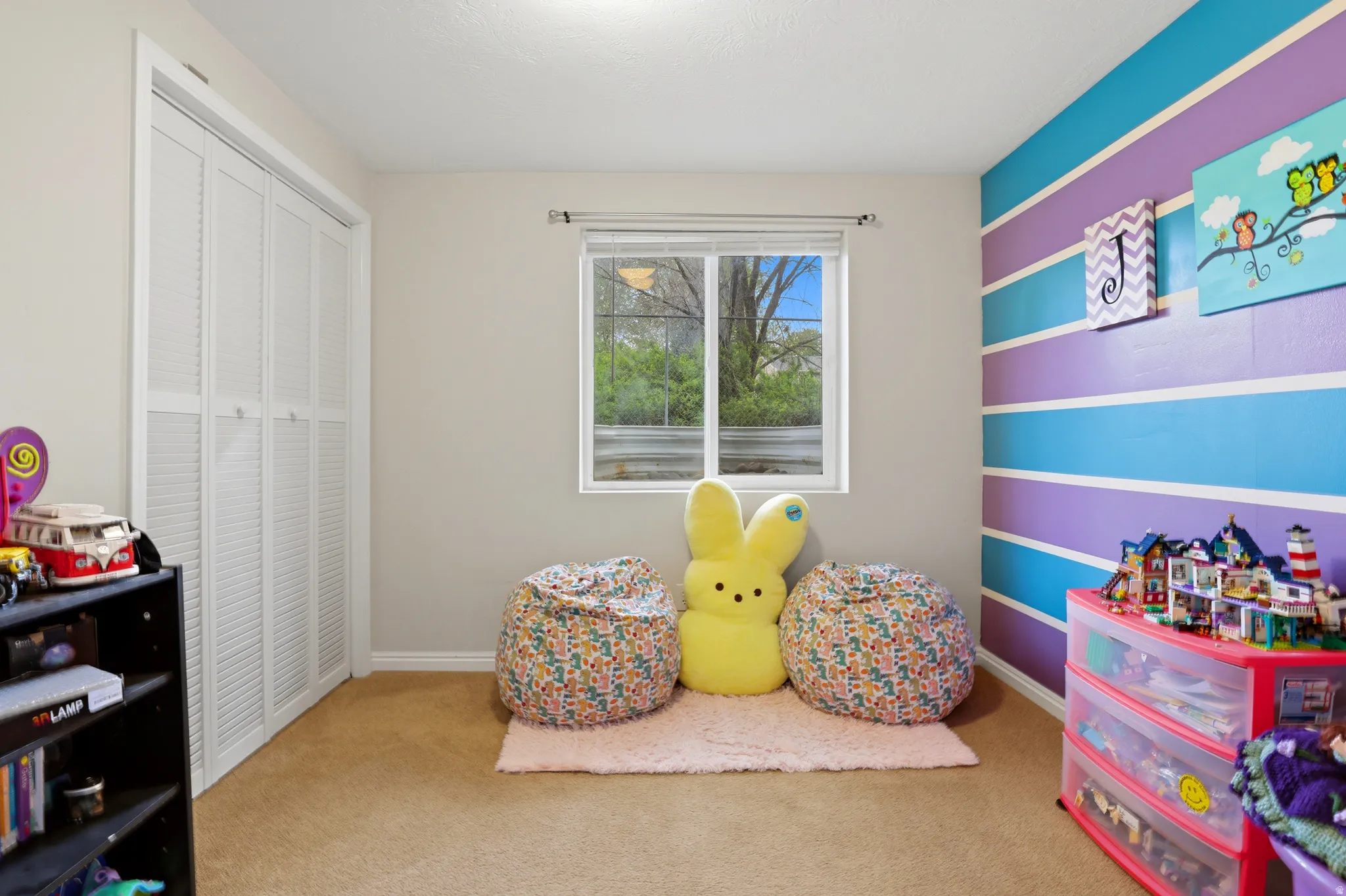 Rec room with light colored carpet
