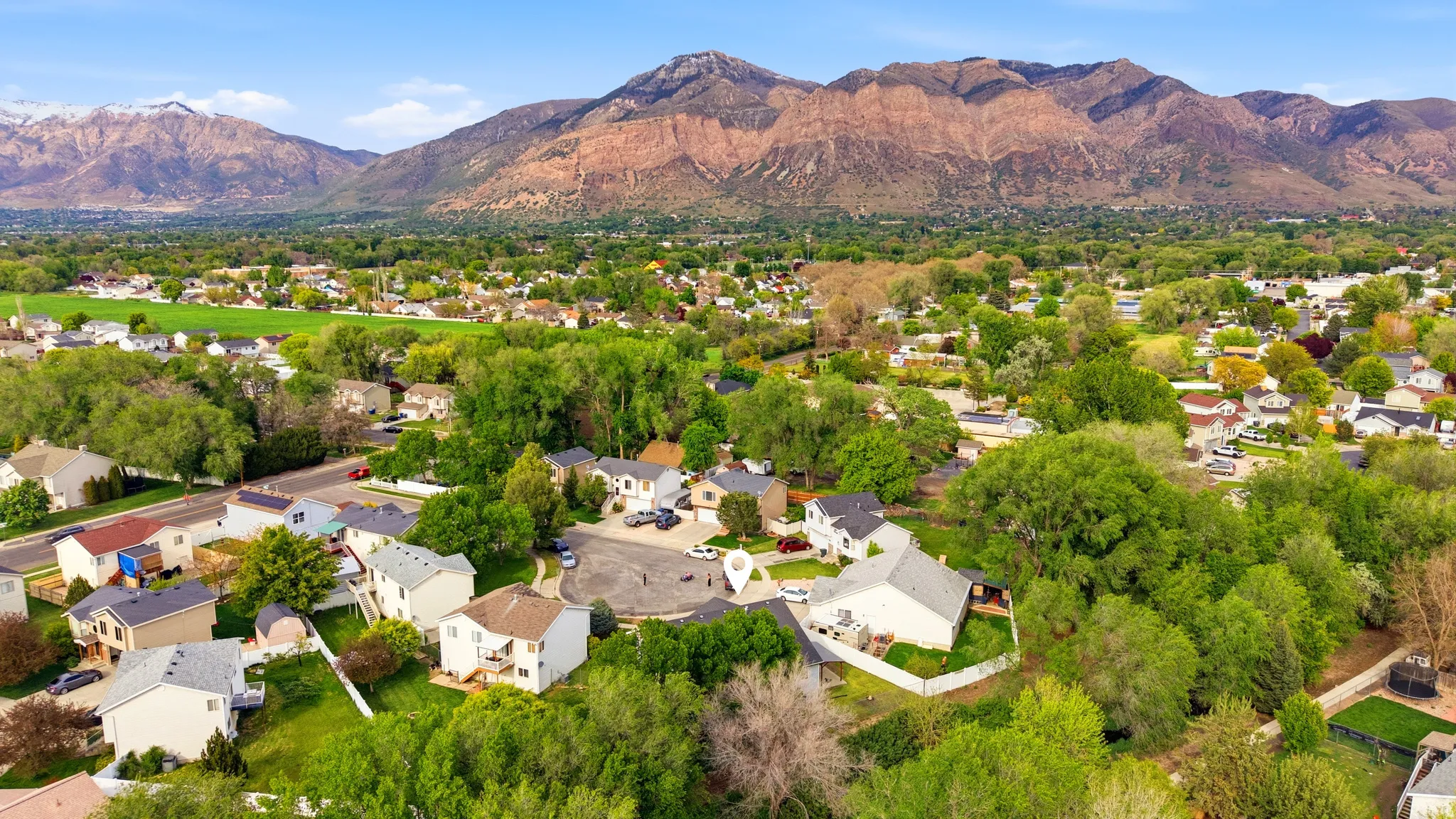 Aerial view of residential area with a mountain backdrop