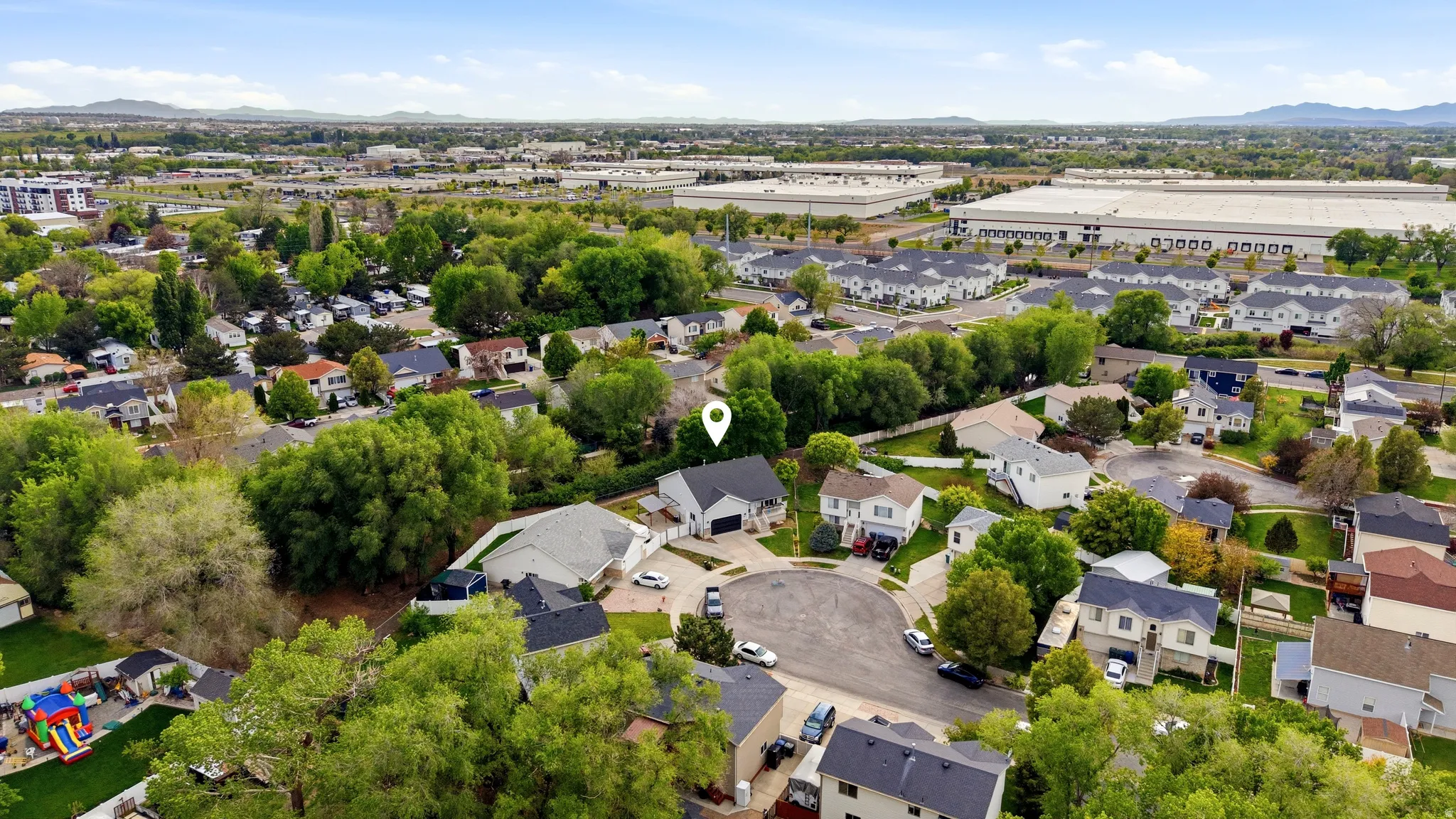 Aerial perspective of suburban area featuring mountains