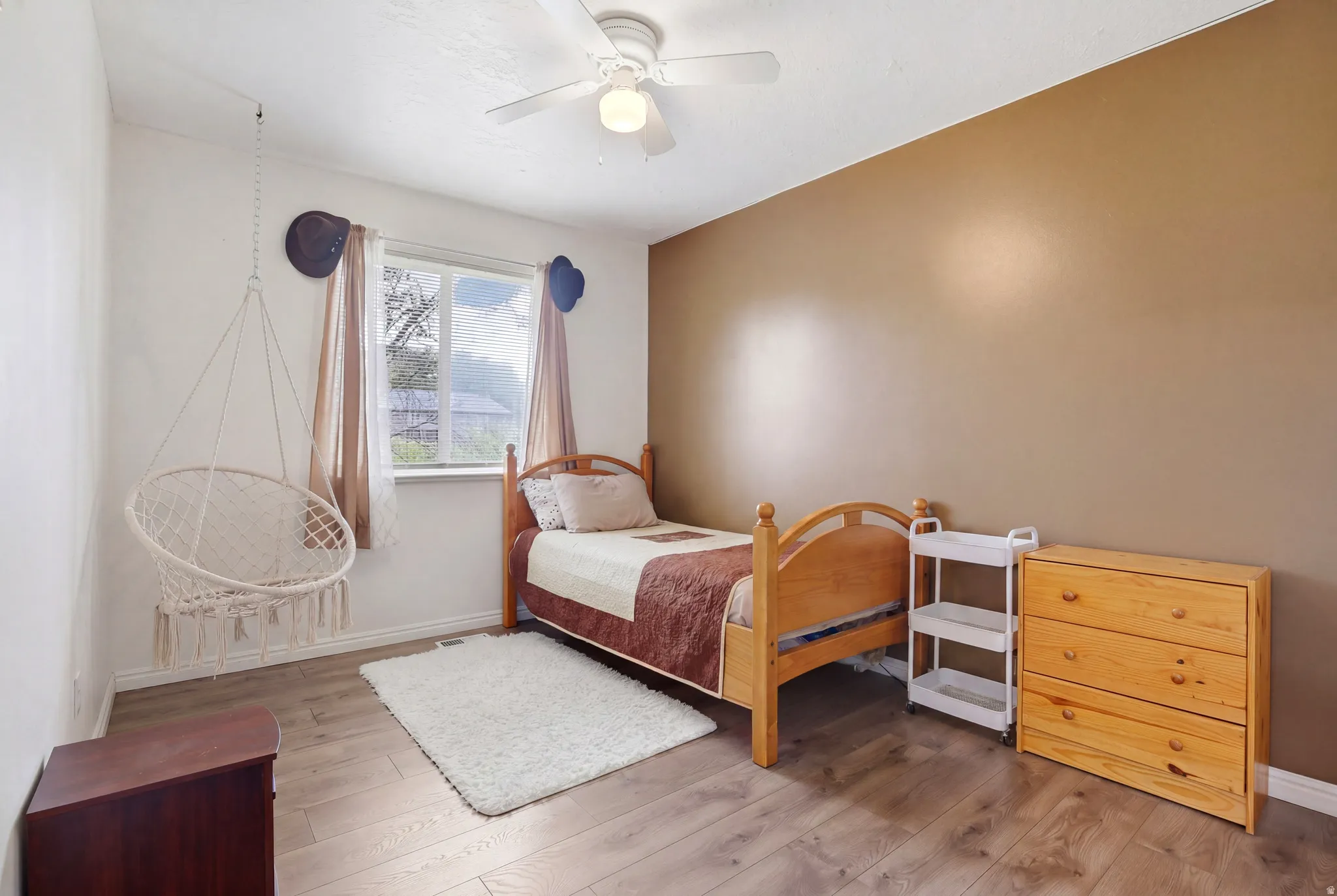 Bedroom featuring light wood-style flooring and ceiling fan