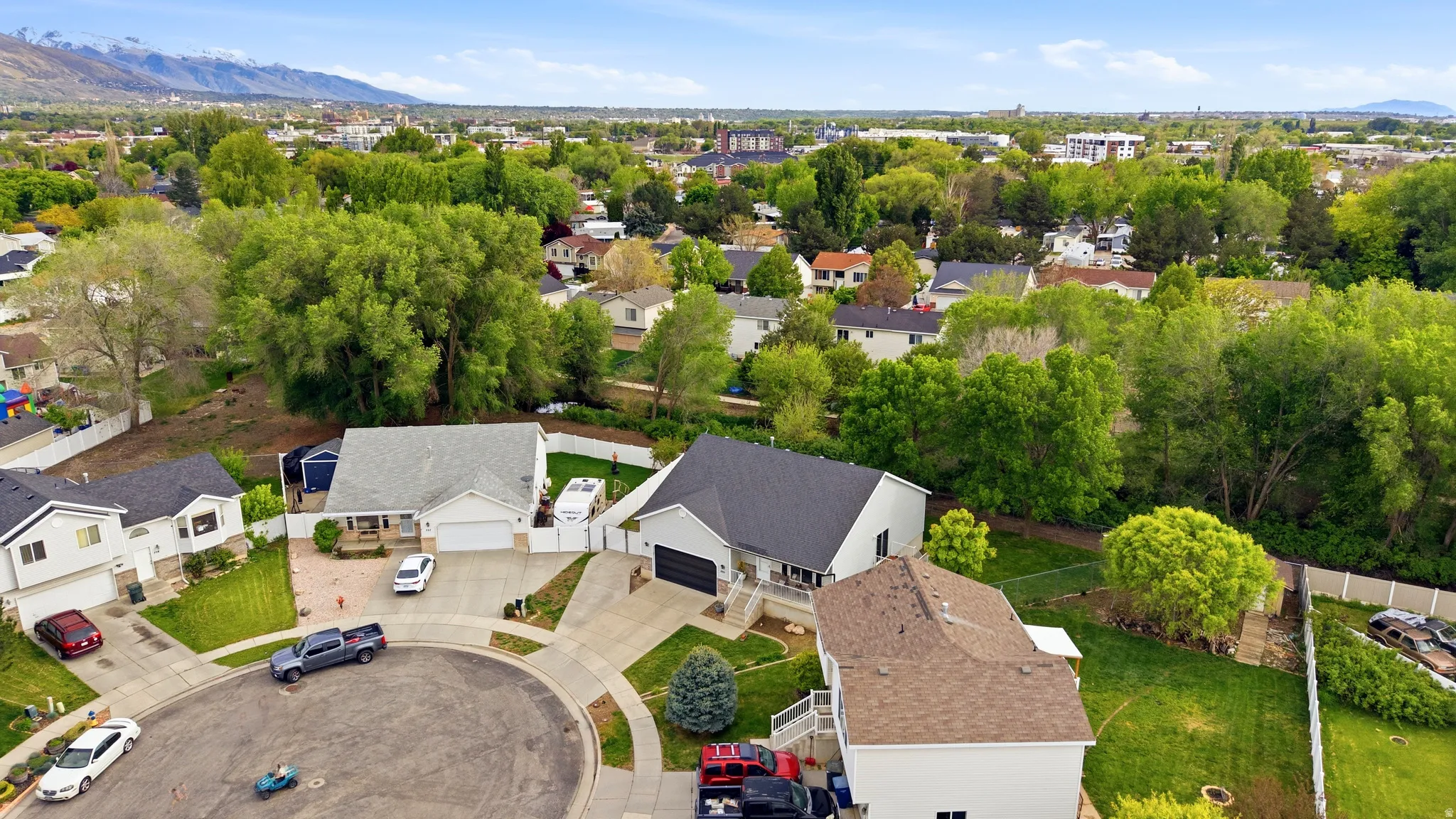 Aerial perspective of suburban area featuring a mountain backdrop