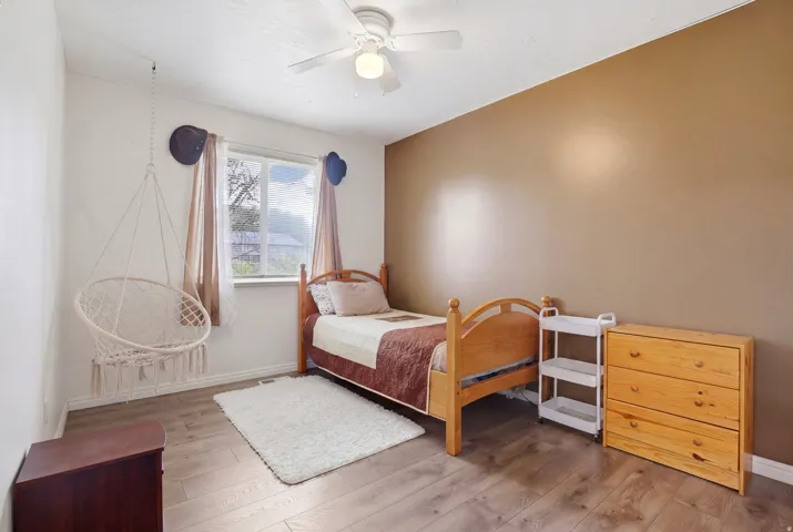 Bedroom featuring light wood-style flooring and ceiling fan