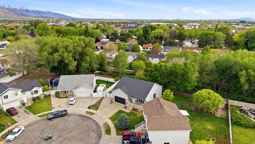 Aerial perspective of suburban area featuring a mountain backdrop