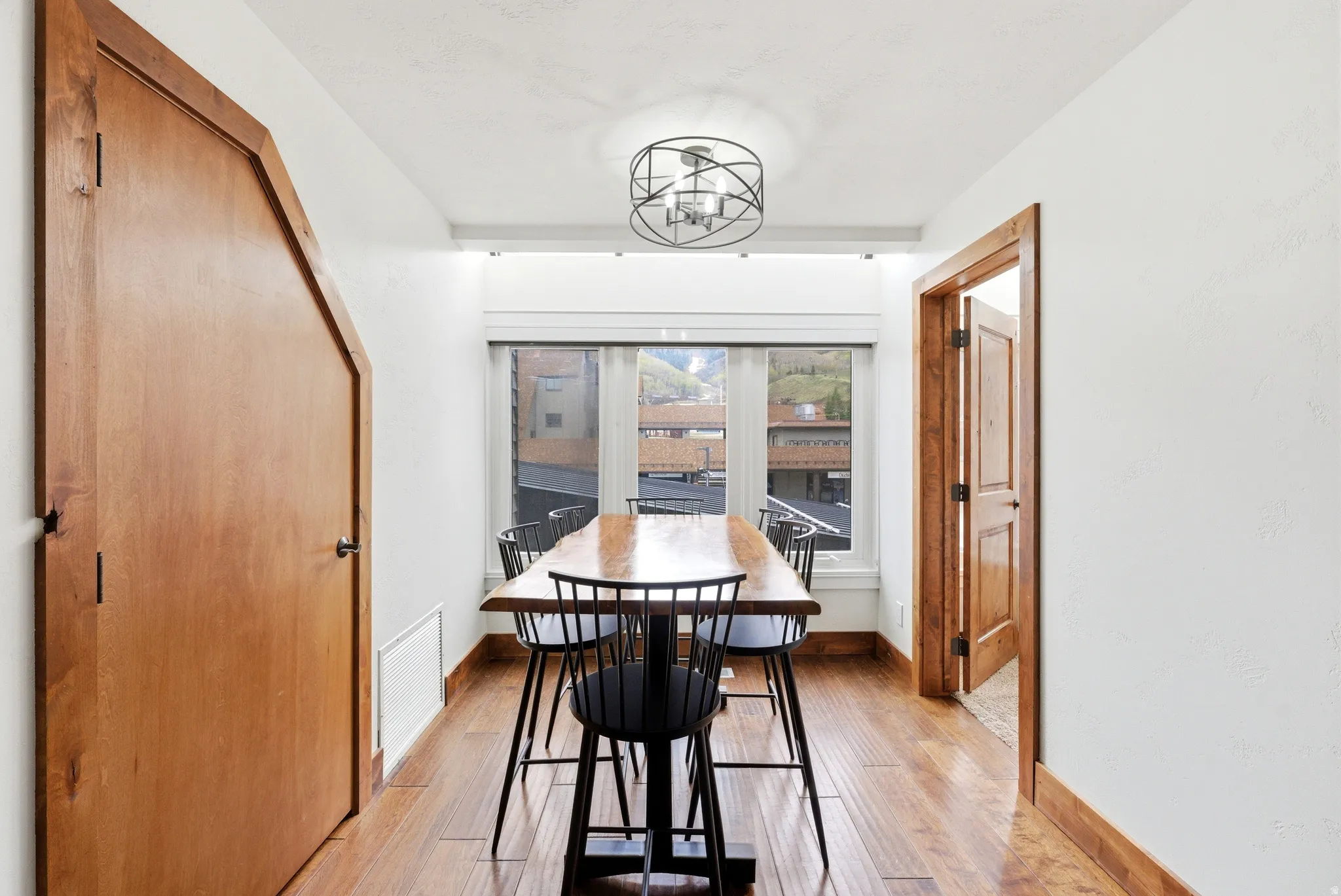 Dining space with light wood-type flooring and baseboards