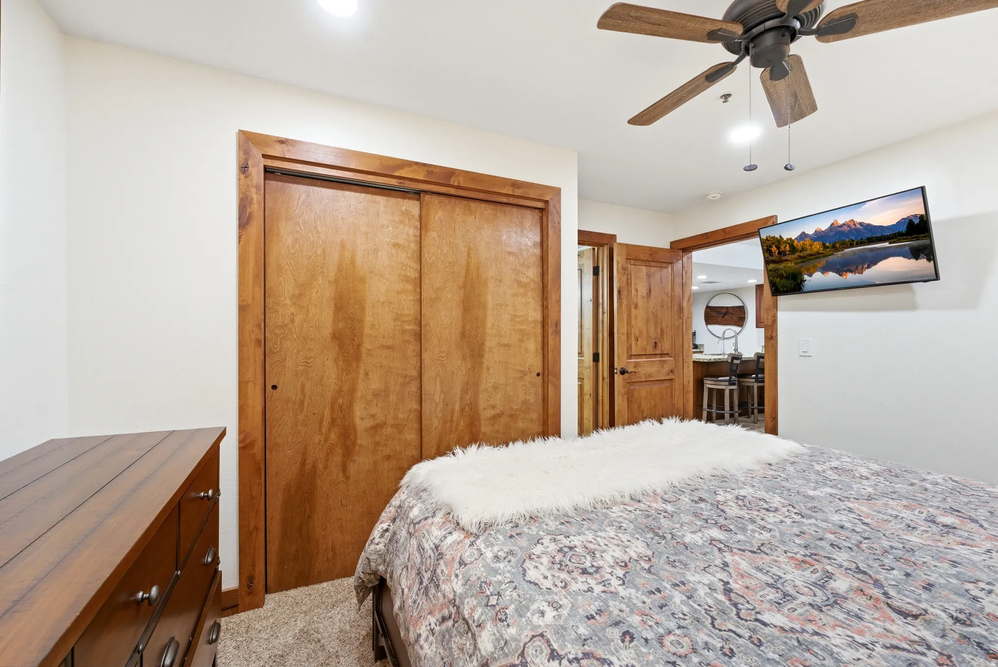 Carpeted bedroom featuring a closet, a ceiling fan, and recessed lighting