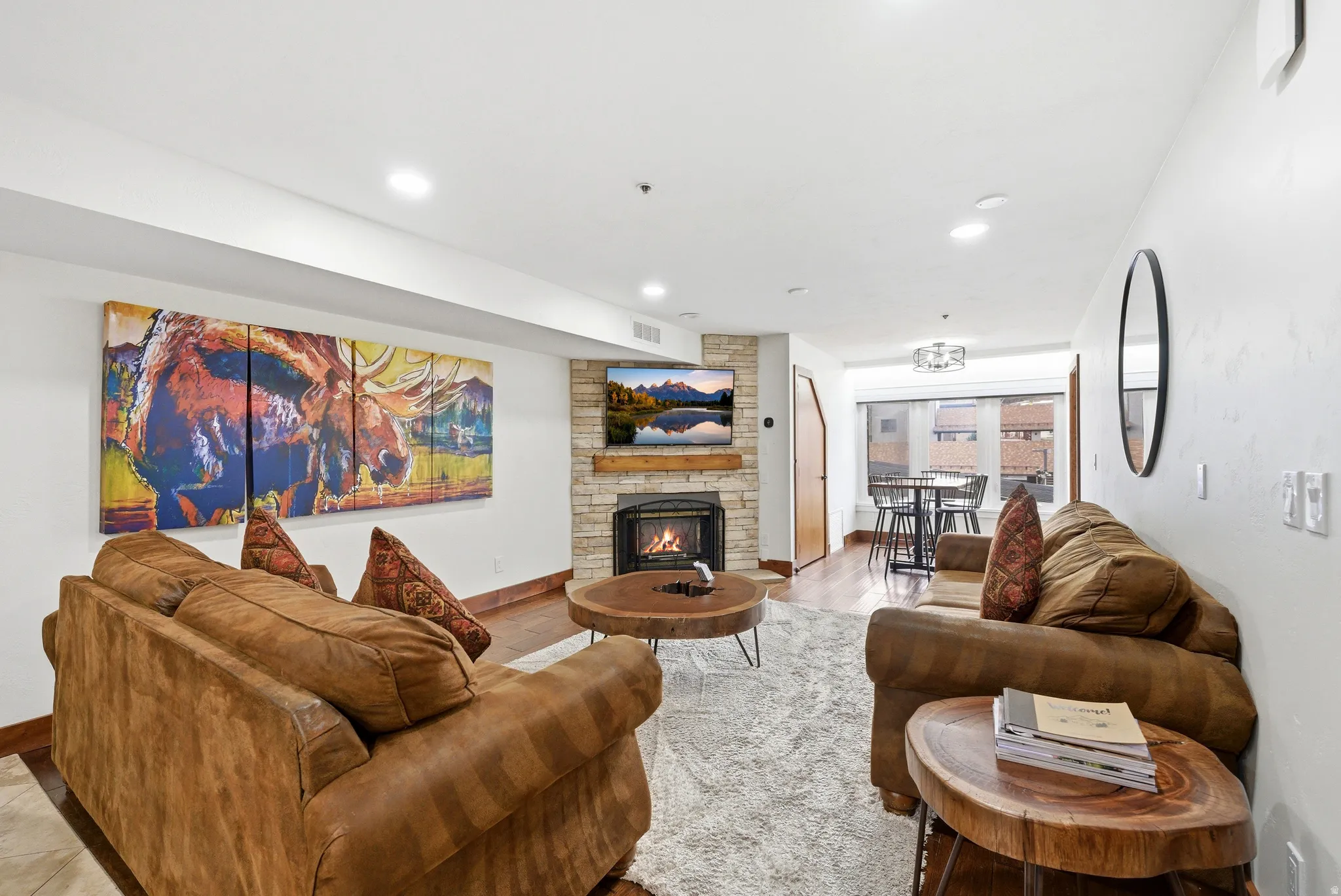 Living area with a fireplace and recessed lighting