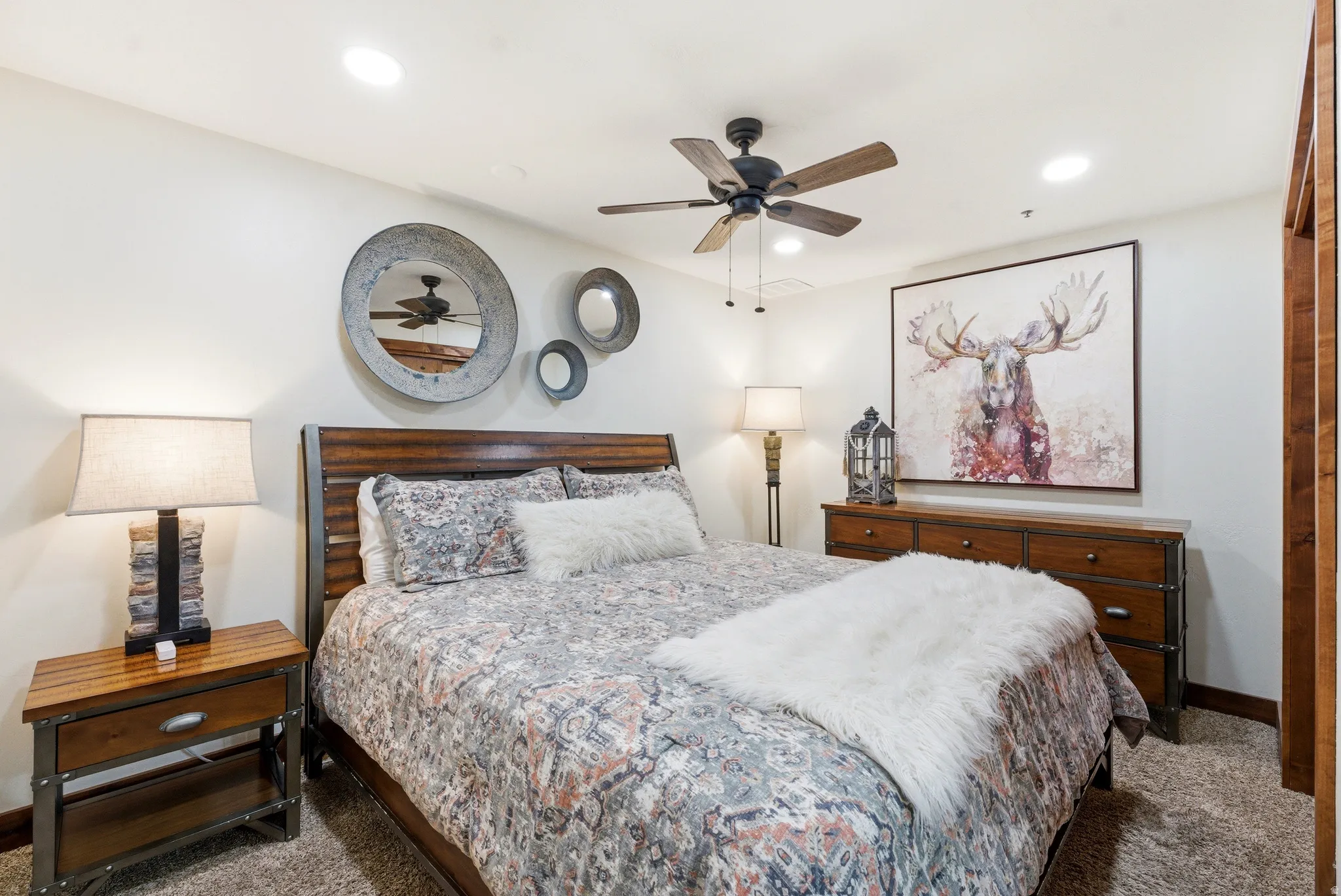 Bedroom with carpet flooring, a ceiling fan, and recessed lighting