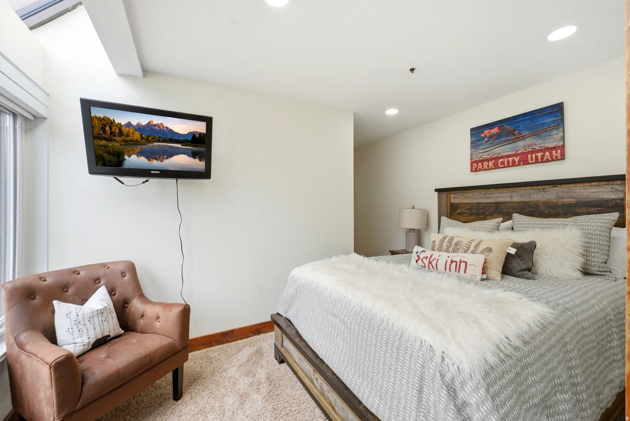 Carpeted bedroom with baseboards and recessed lighting