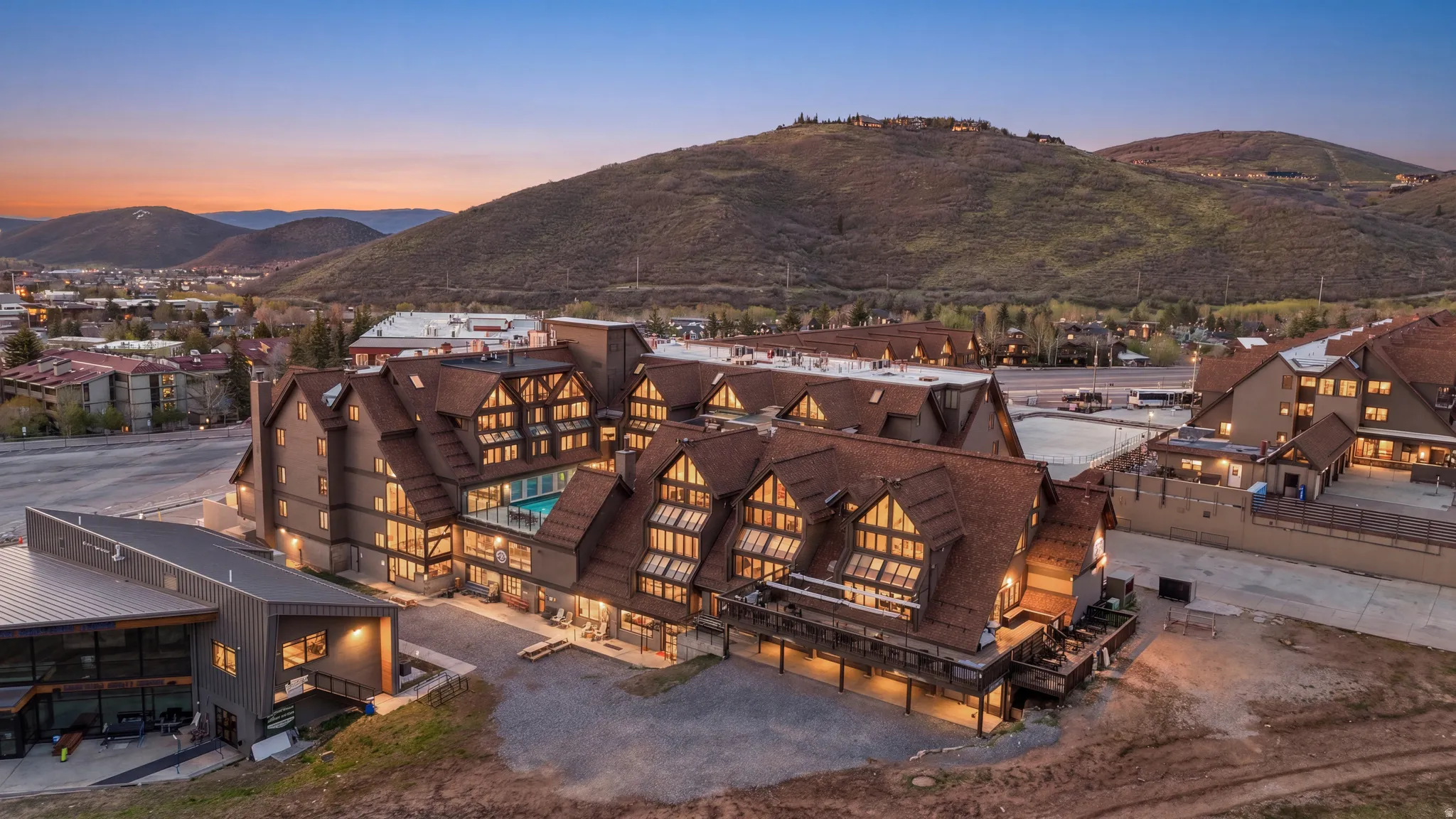 Aerial view at dusk of a mountain view and a residential view