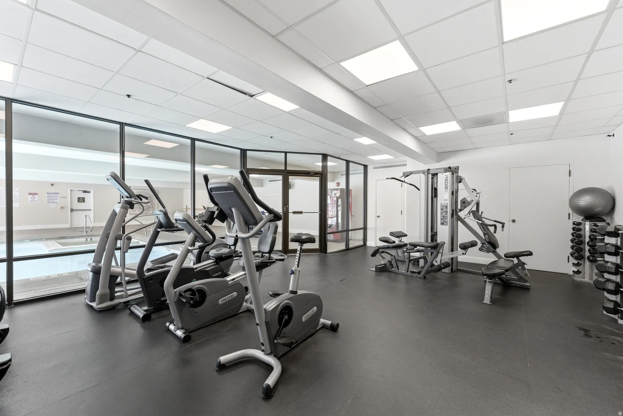 Exercise room featuring a drop ceiling