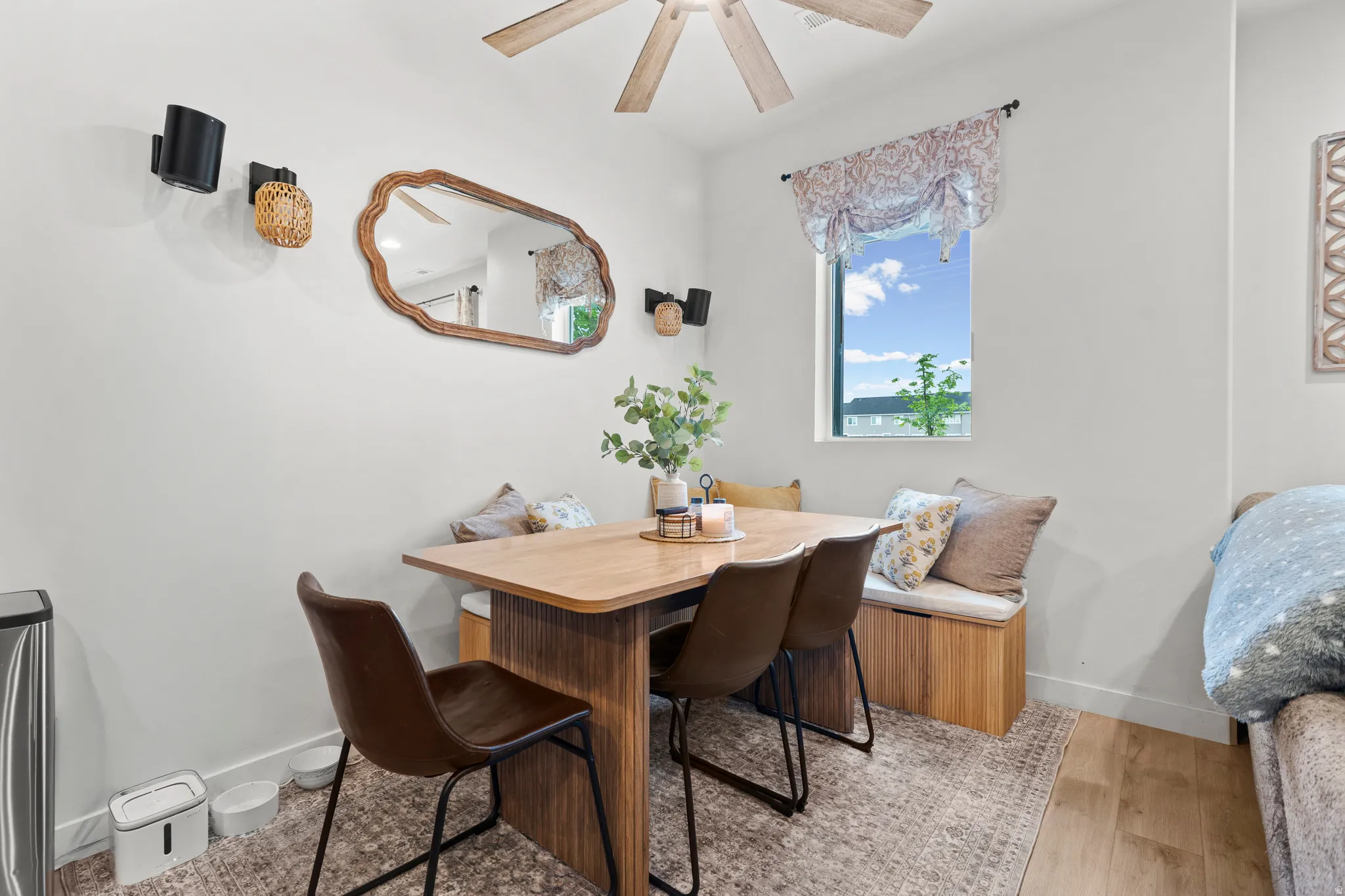 Dining room featuring breakfast area, light wood-style flooring, and a ceiling fan