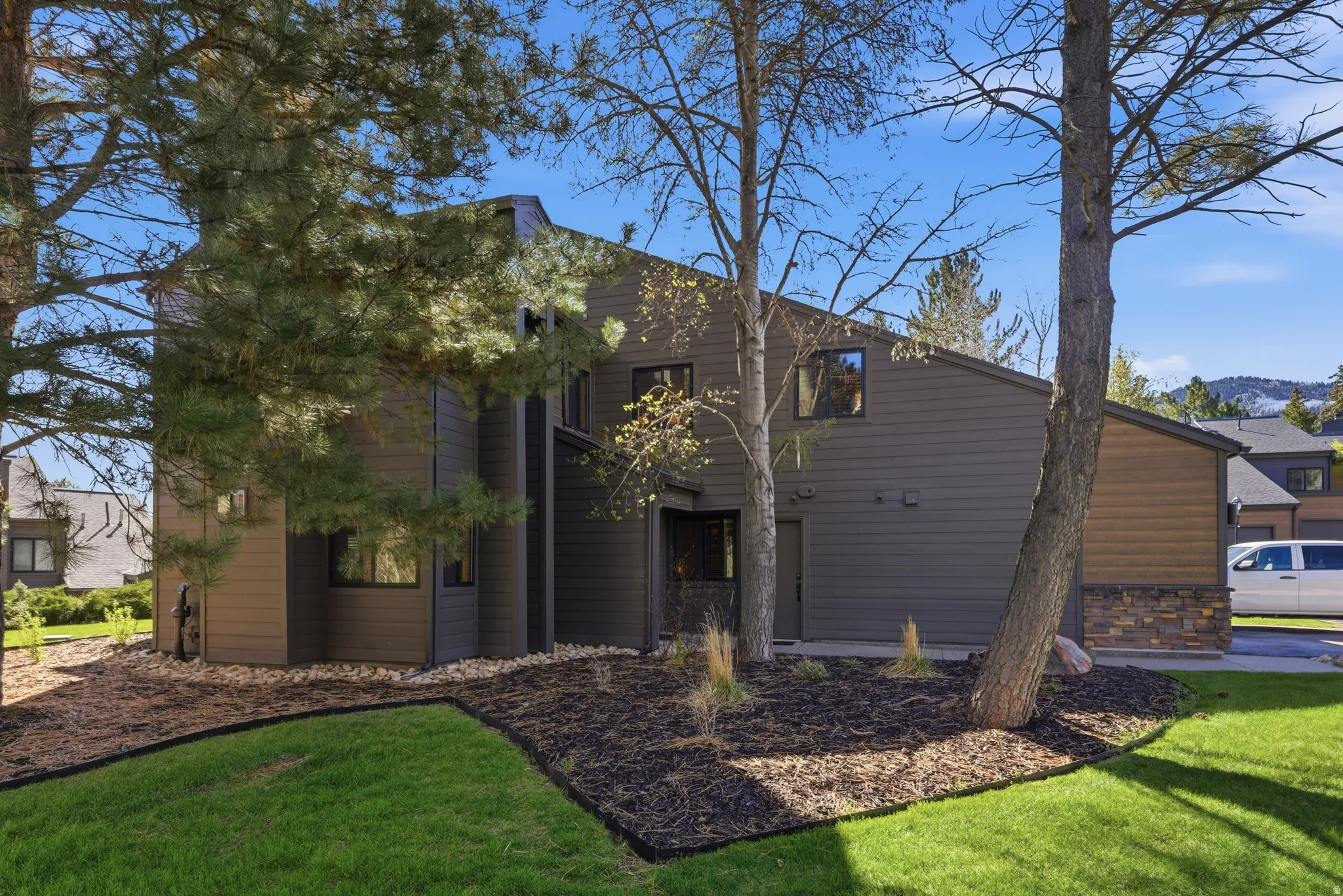 Contemporary house featuring a front lawn