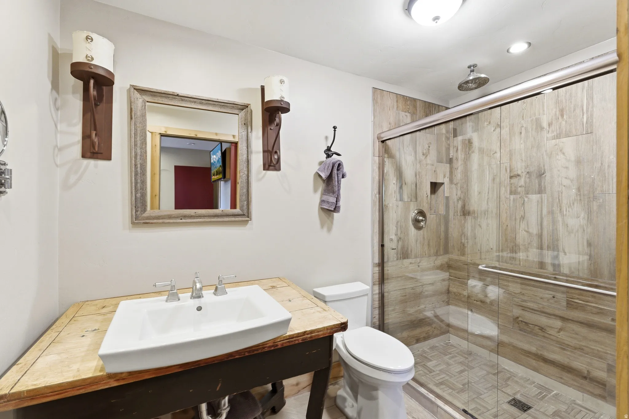 Full bathroom with a sink and a stall shower