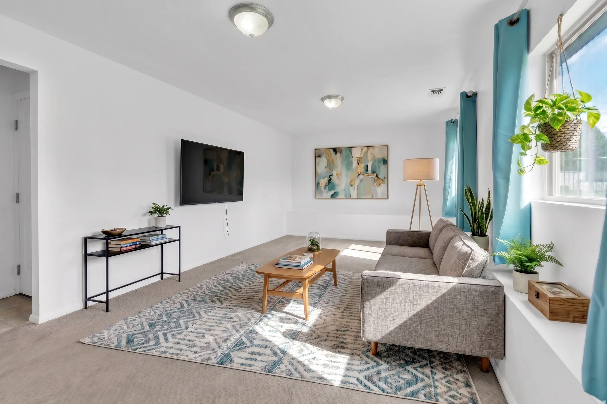 Living room featuring carpet floors and healthy amount of natural light