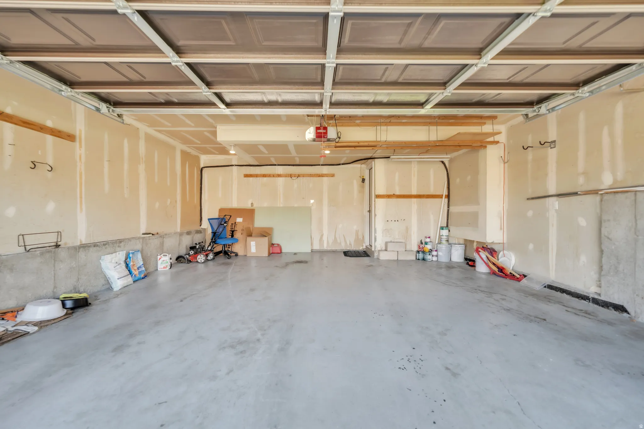 Garage featuring a garage door opener