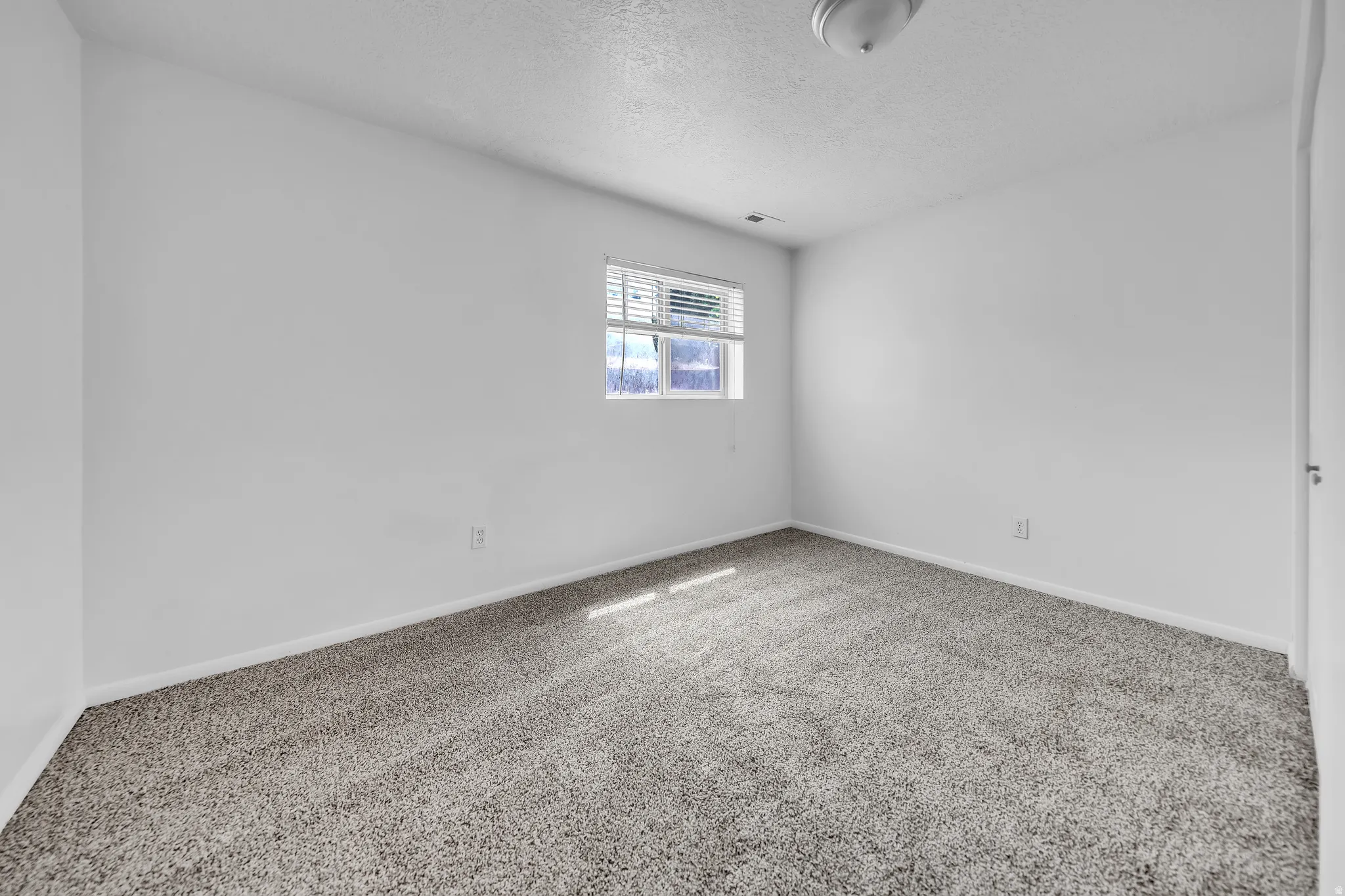 Neutral tone wall paint with baseboard trim