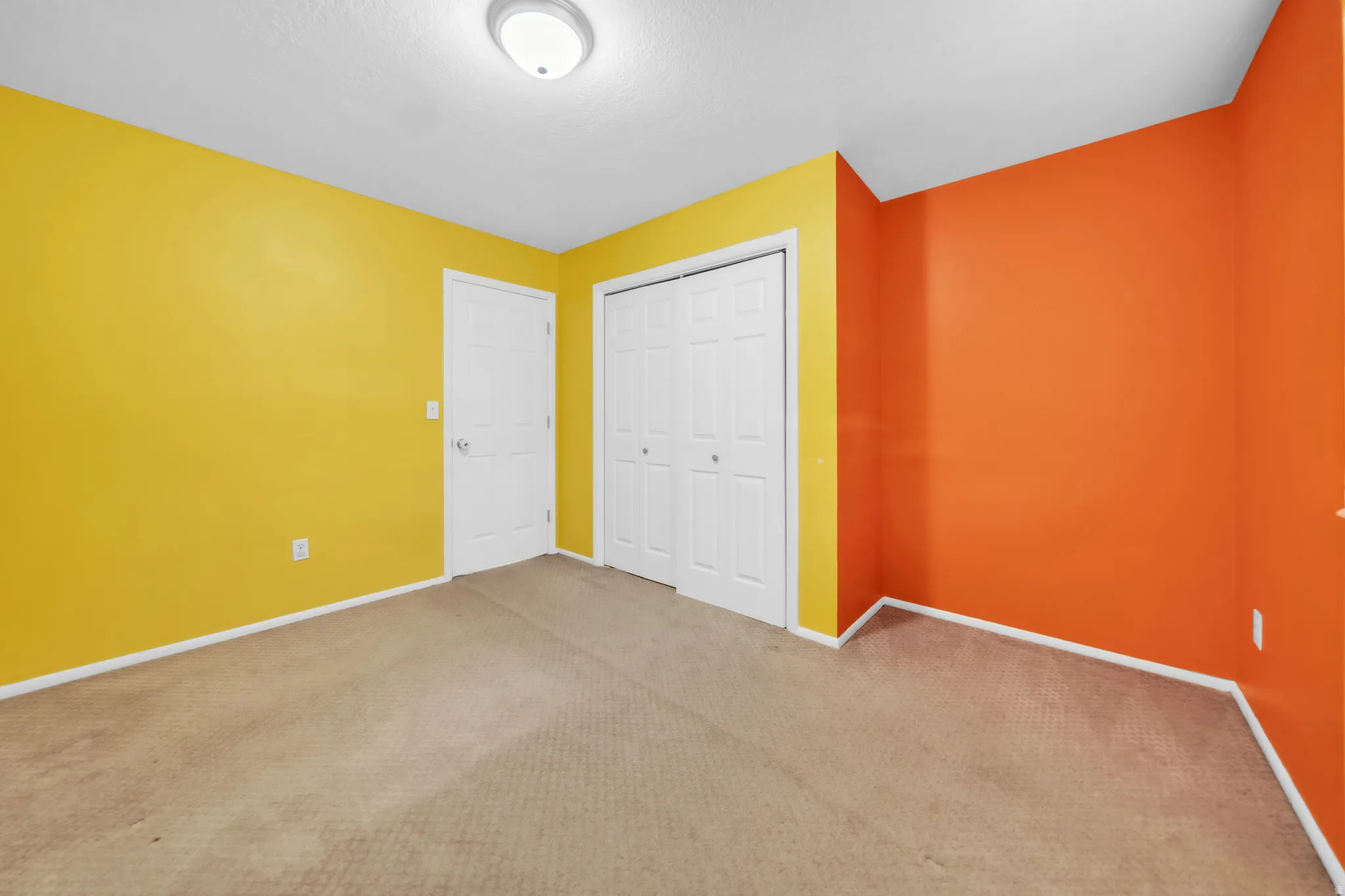 Unfurnished bedroom with carpet flooring and a closet