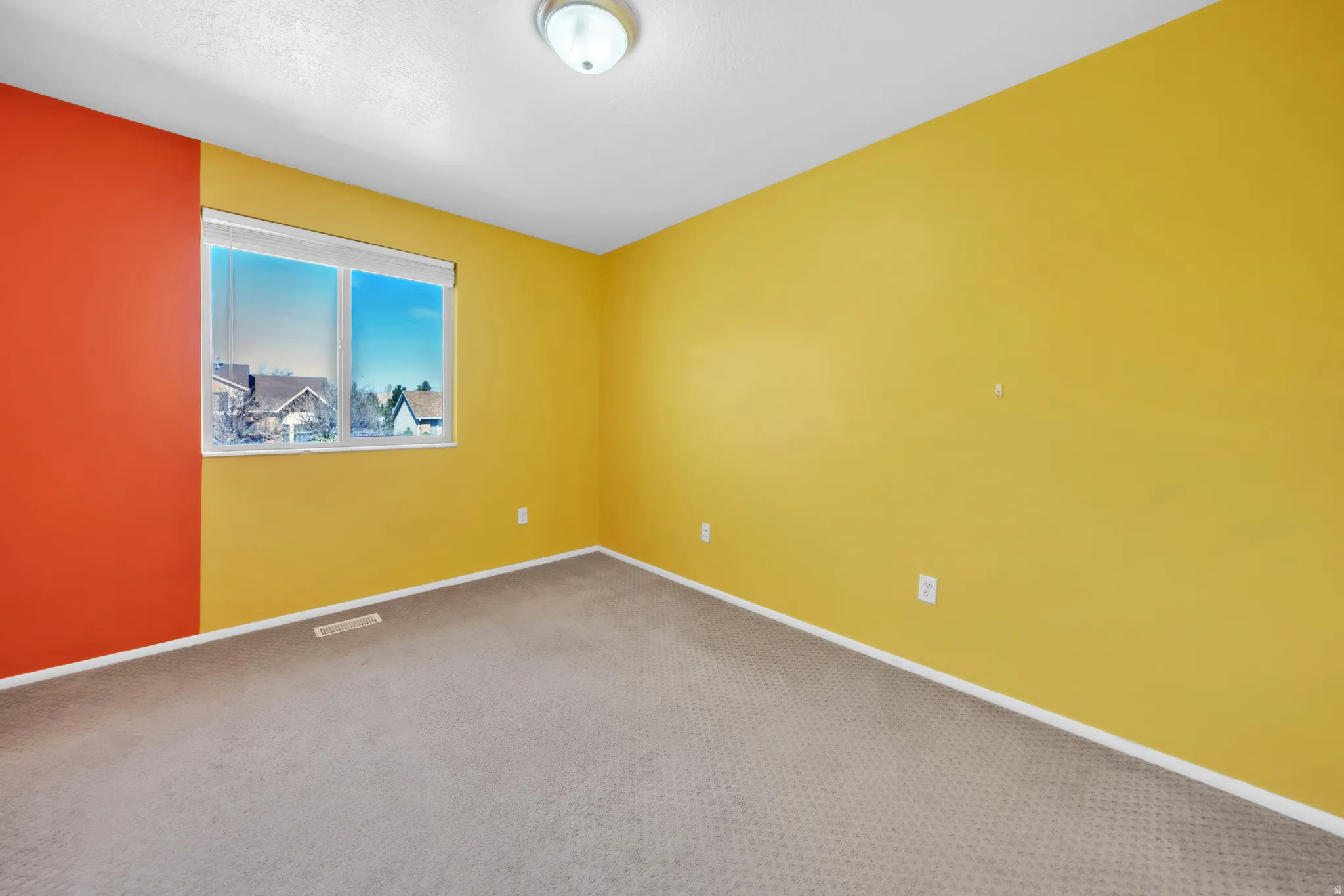 Spare room featuring carpet