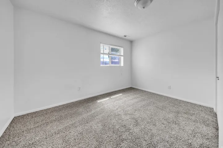 Neutral tone wall paint with baseboard trim