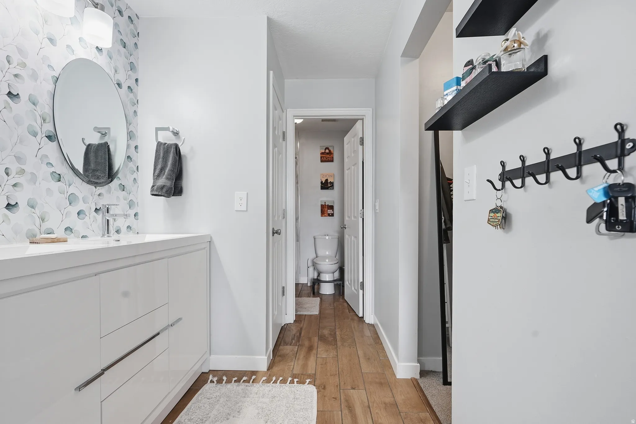 Bathroom with vanity and light wood-type flooring
