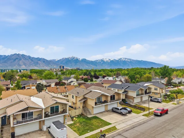 Aerial perspective of suburban area featuring a mountainous background