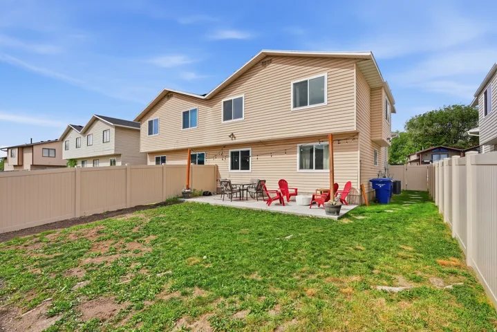 Back of house featuring a patio area and a fenced backyard