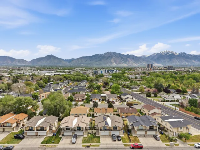 Aerial view of residential area featuring a mountainous background