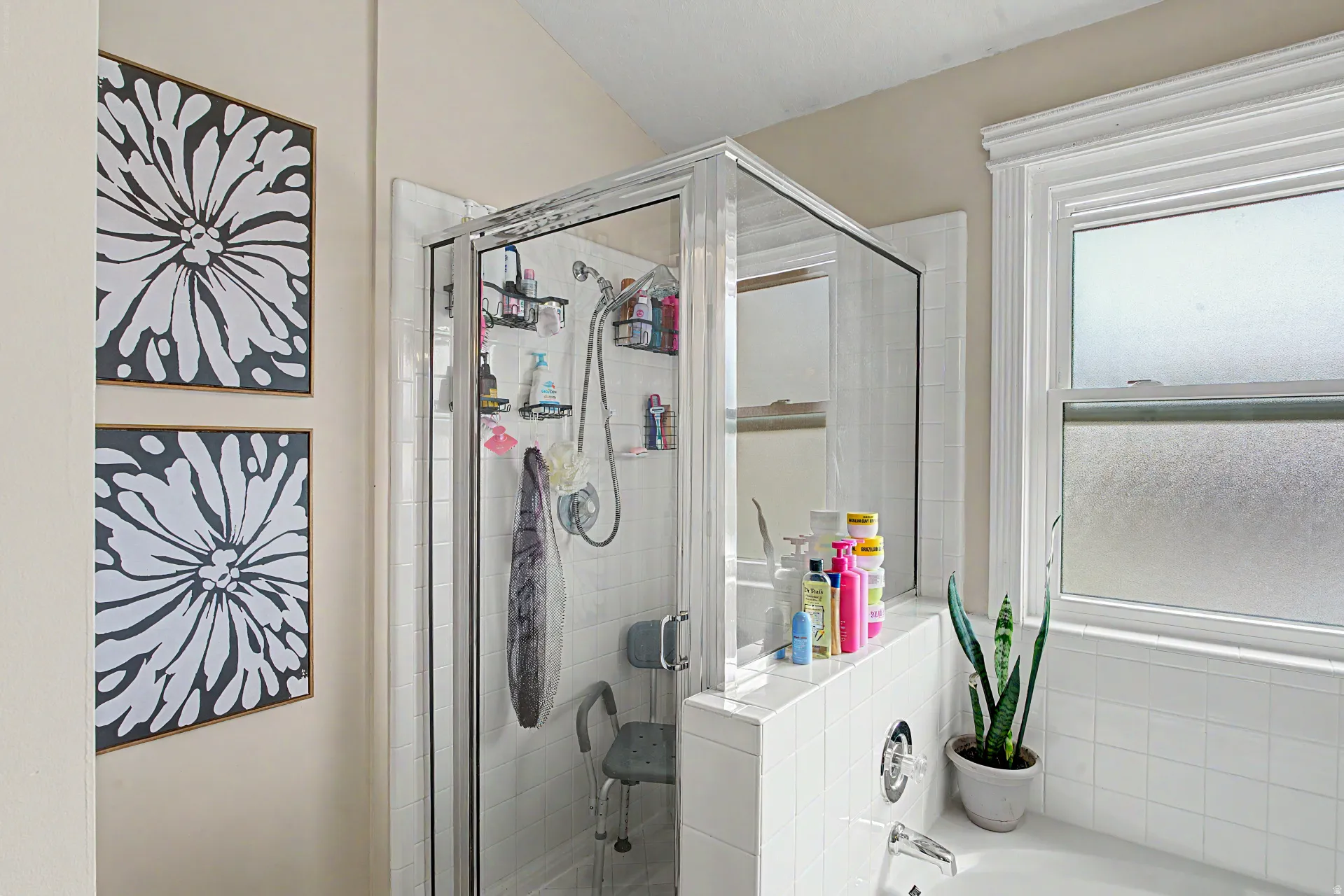 Bathroom featuring a stall shower and a garden tub