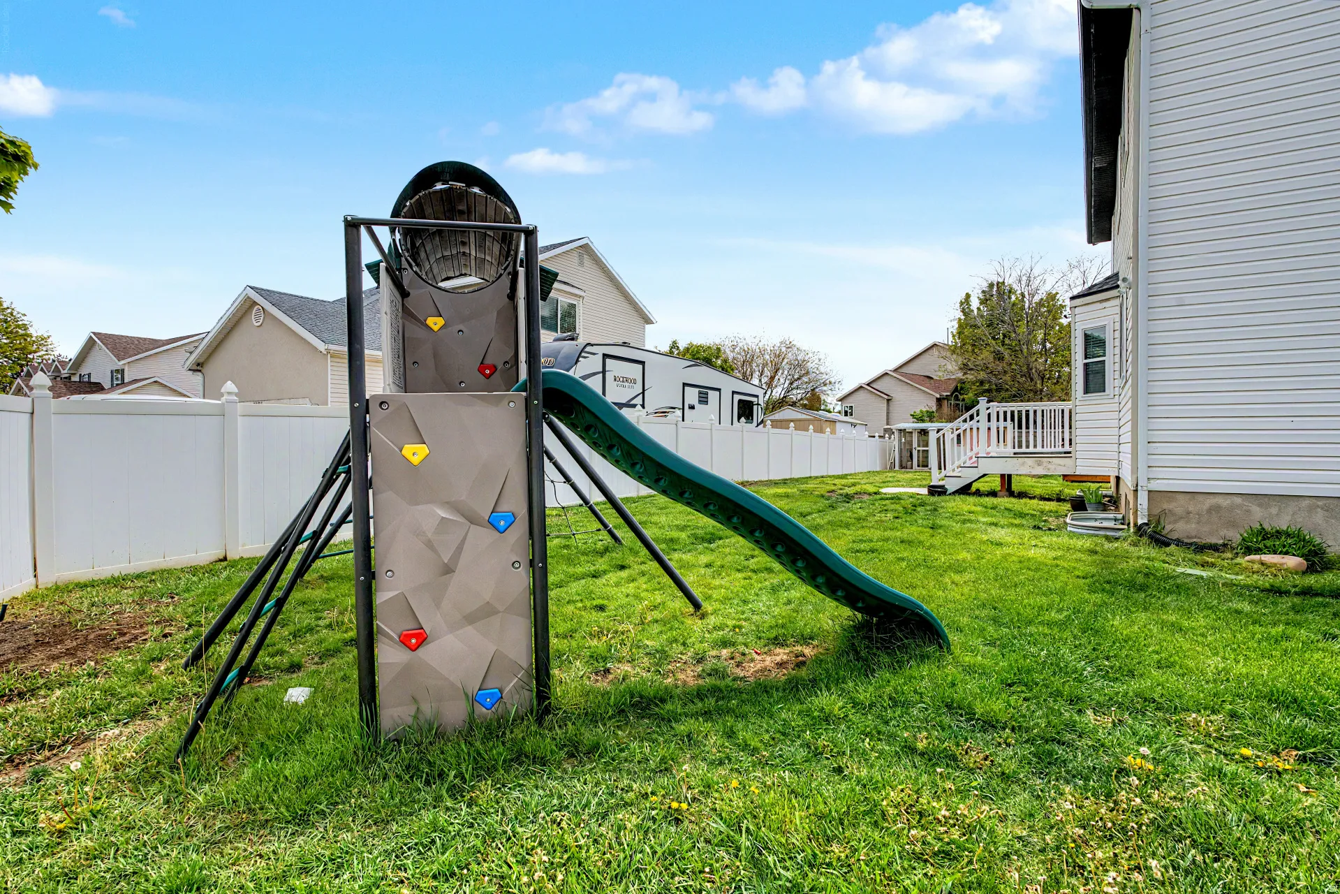 View of jungle gym featuring a residential view