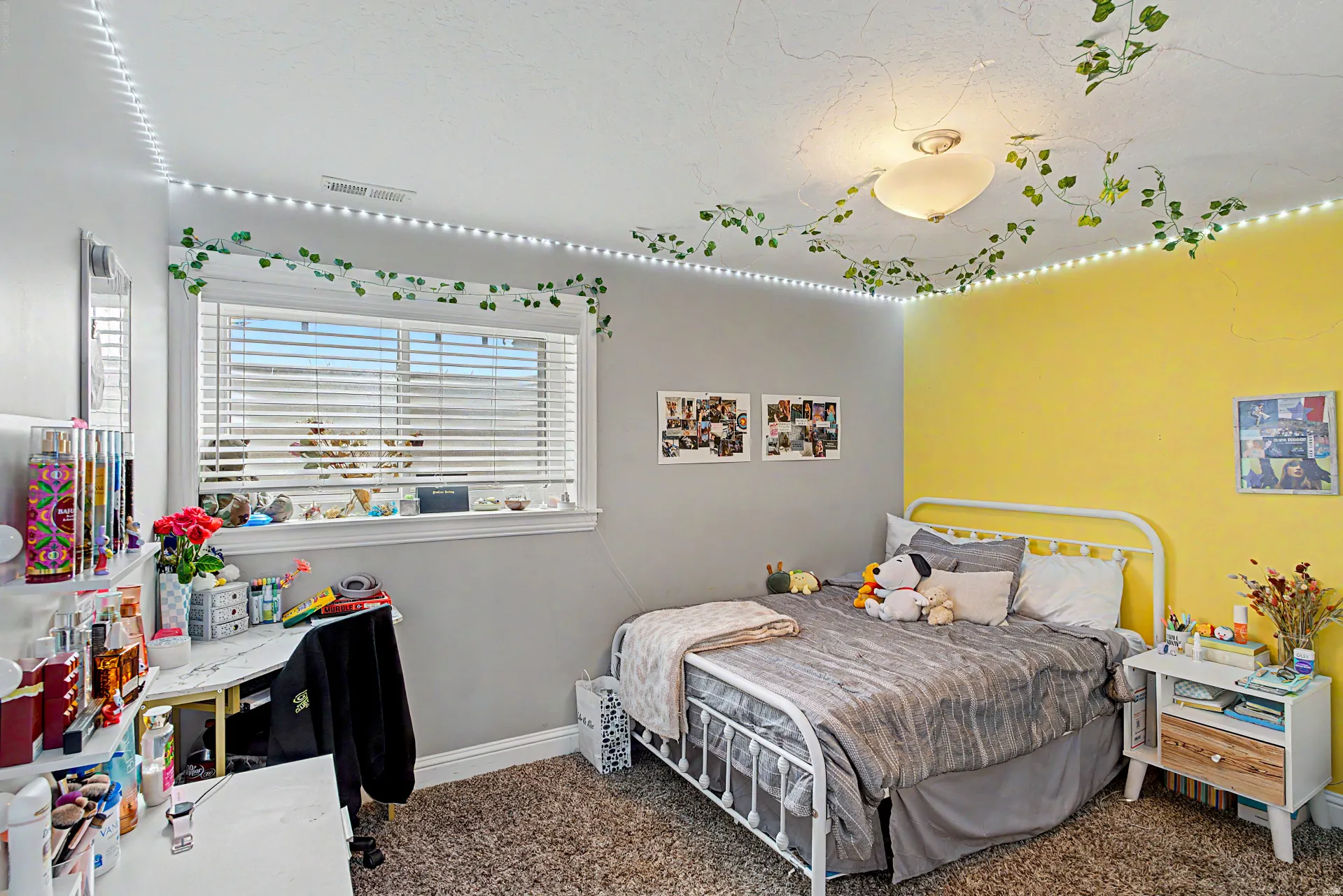 Bedroom with dark colored carpet and baseboards