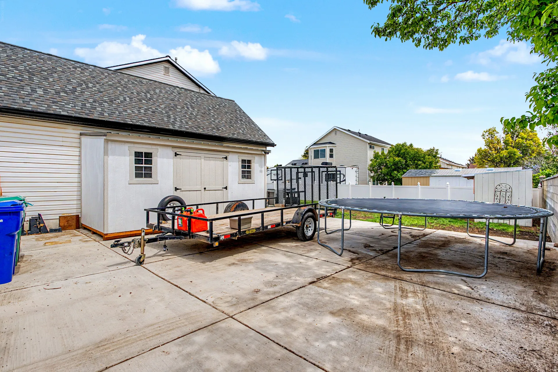 Behind fence rv parking with included shed for yard equipment