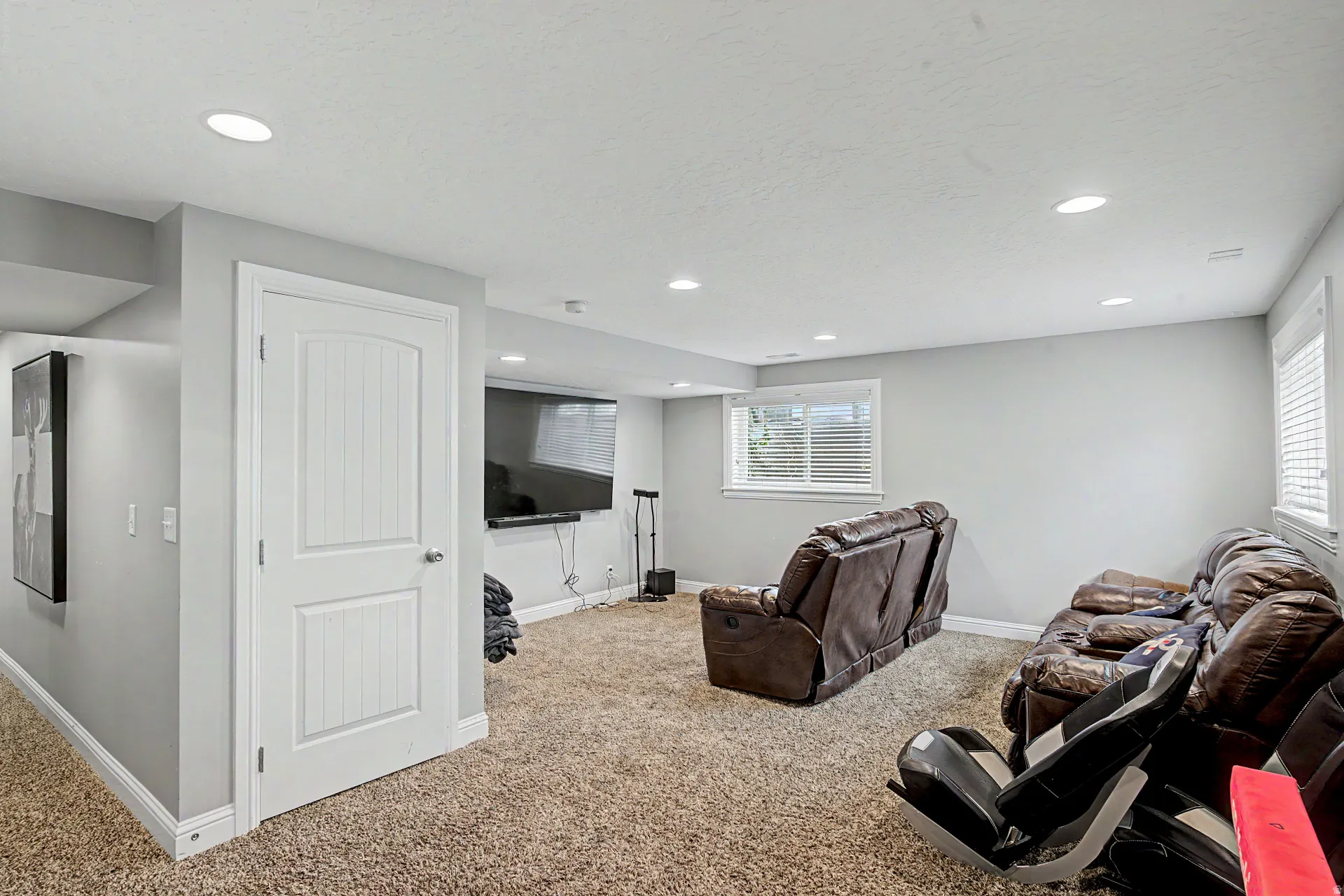 Living room with carpet floors and recessed lighting