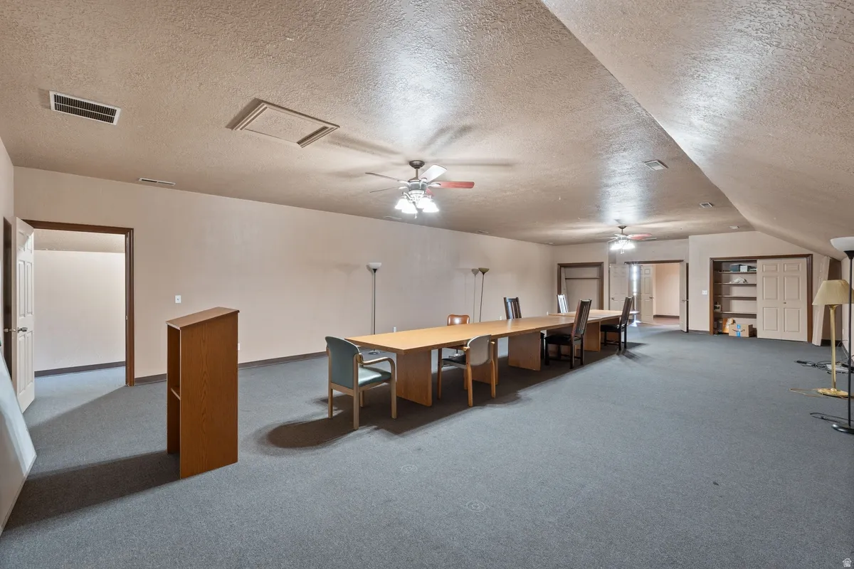Misc room featuring a ceiling fan