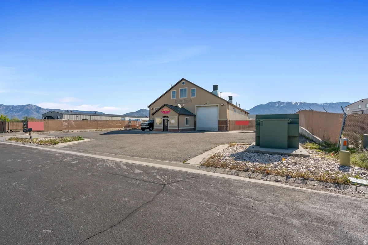 View of front of property featuring a mountain view and a garage
