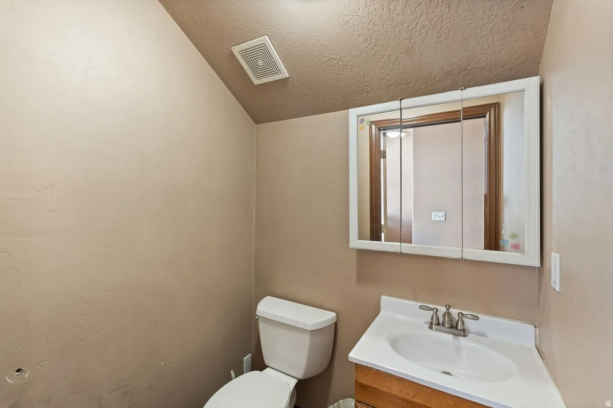 Bathroom with vanity and toilet