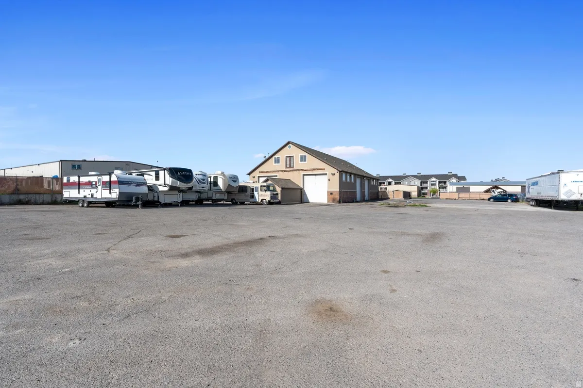 View of parking with a residential view