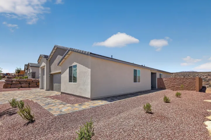 Stucco exterior with a tiled roofline