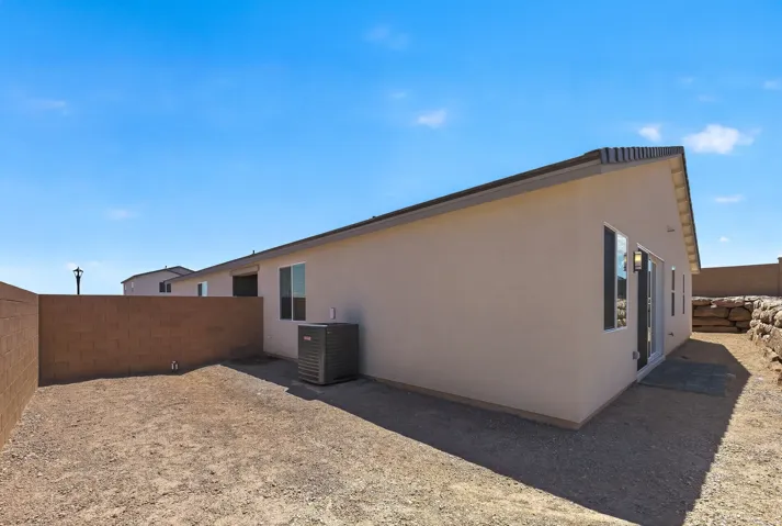 Modern residential structure featuring a clean stucco exterior in neutral tones with contemporary architectural lines