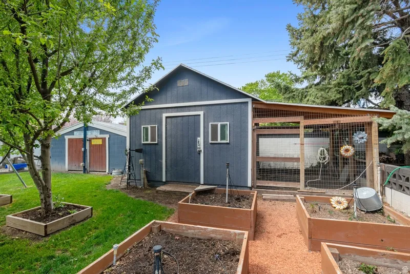 View of shed featuring a garden