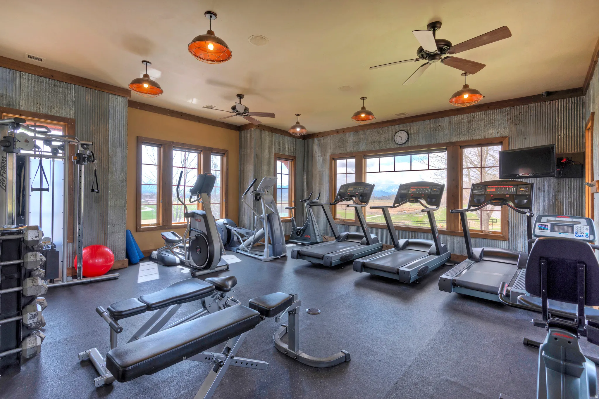Gym featuring a ceiling fan