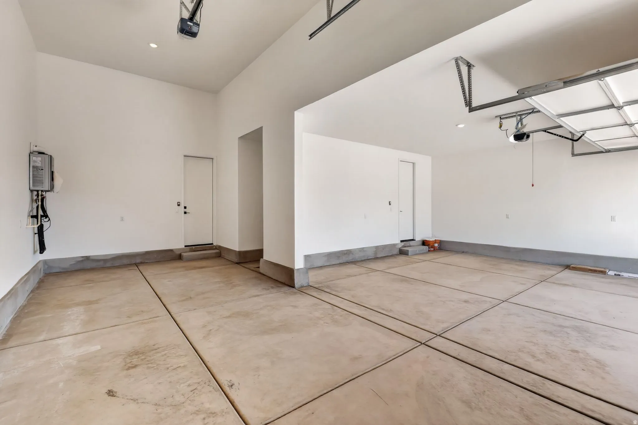 Garage featuring a garage door opener