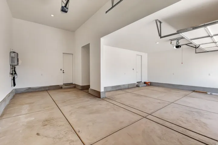 Garage featuring a garage door opener