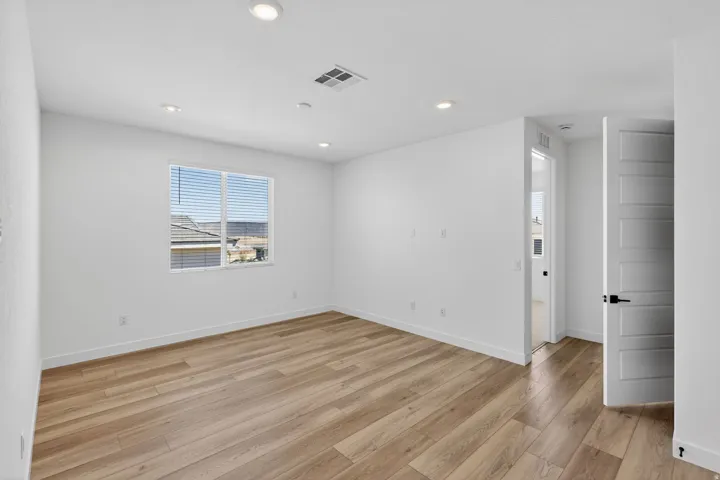 Unfurnished room with light wood-style floors and recessed lighting