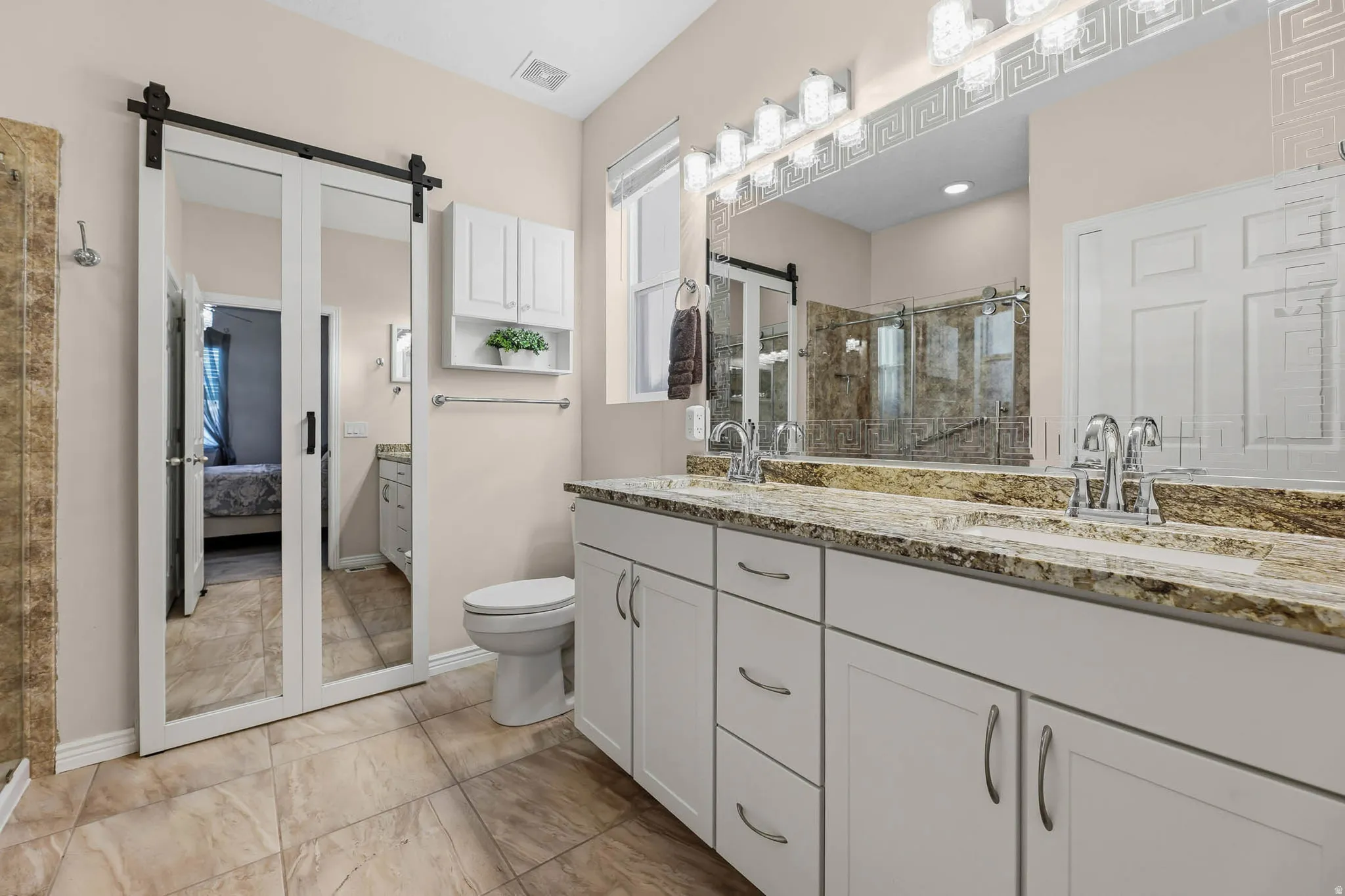 Spacious en suite bathroom for the primary bedroom.