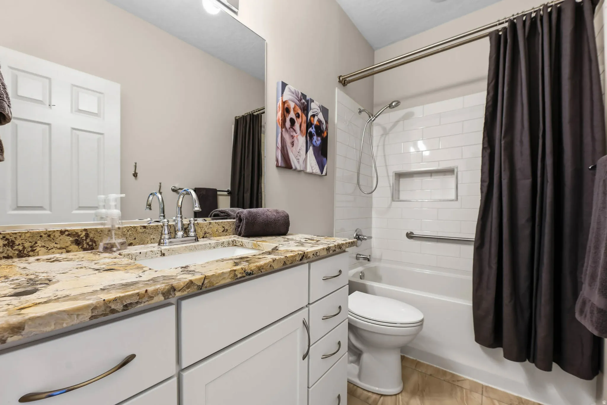 Super clean secondary bathroom with beautiful granite countertops.